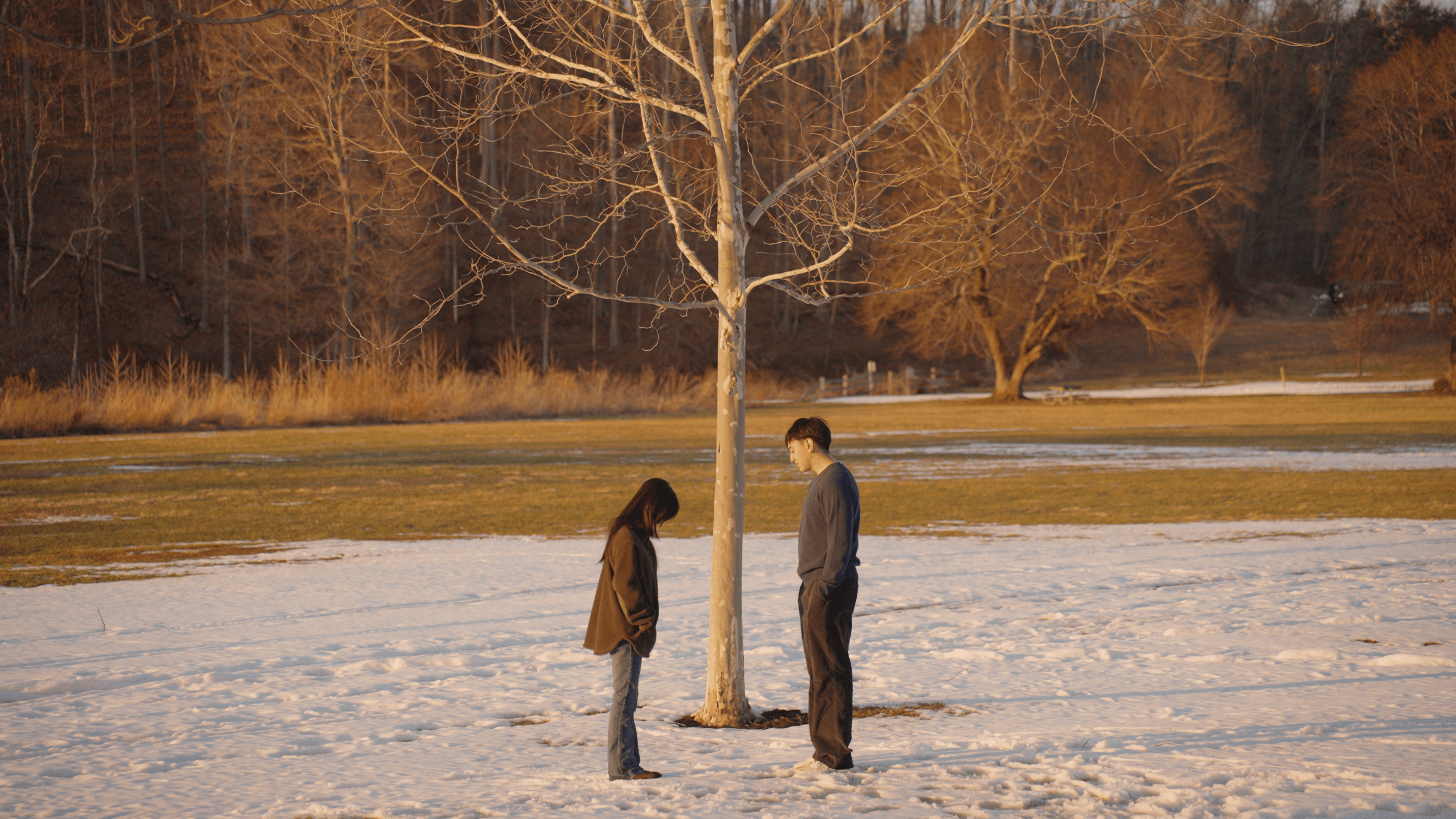 Guy and girl meeting at sunset