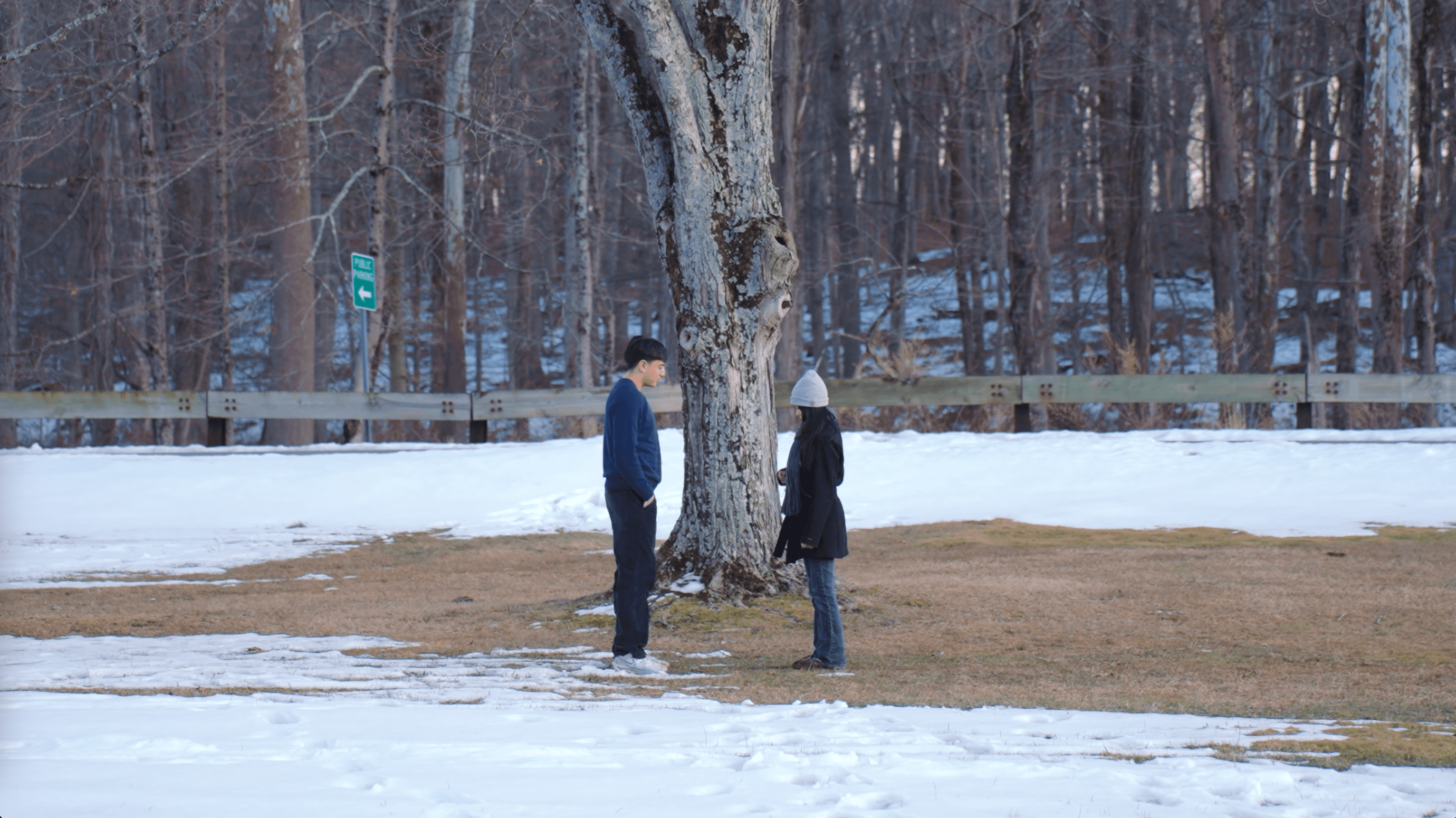 Guy and girl meet at snowy field
